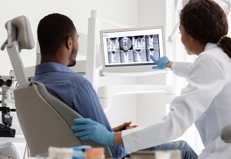 A dental X ray being read on screen before surgical treatment