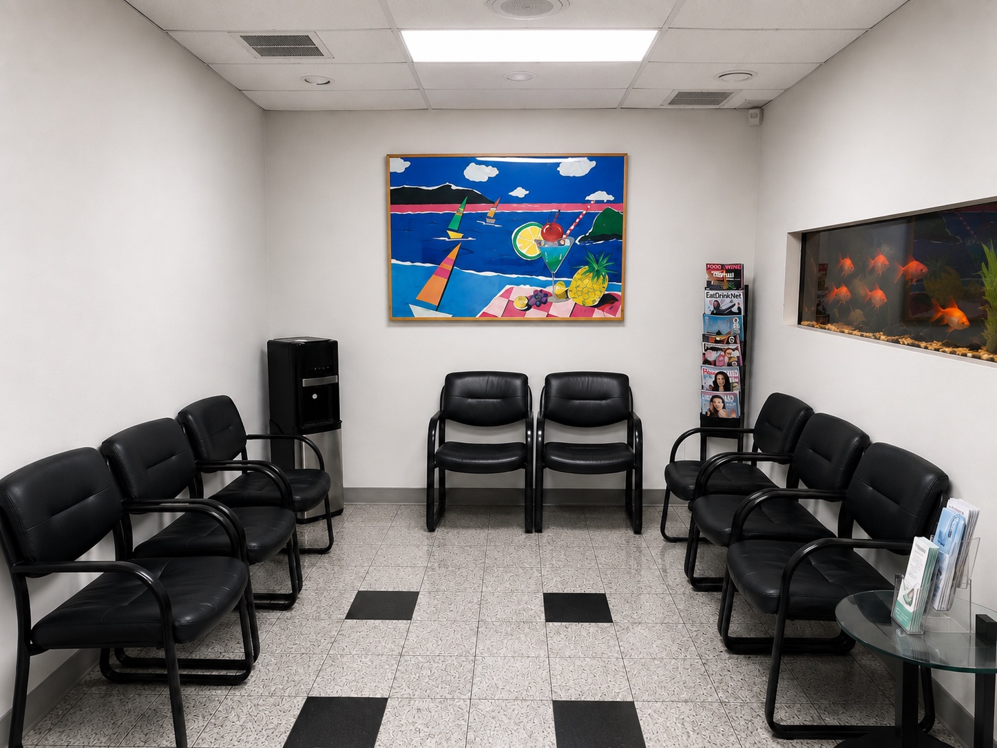 The waiting room at the Maple Avenue office, with seating, magazines and an aquarium